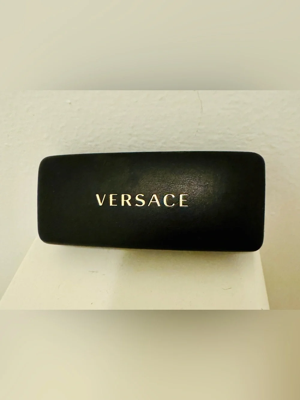 Versace. Black rigid leather Versace case with gold lettering (for sunglasses or